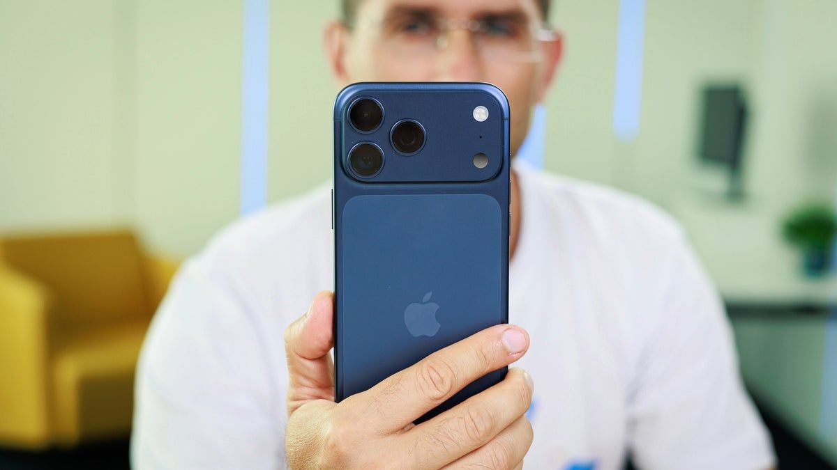 A photo of a person holding the iPhone 17 Pro Max.